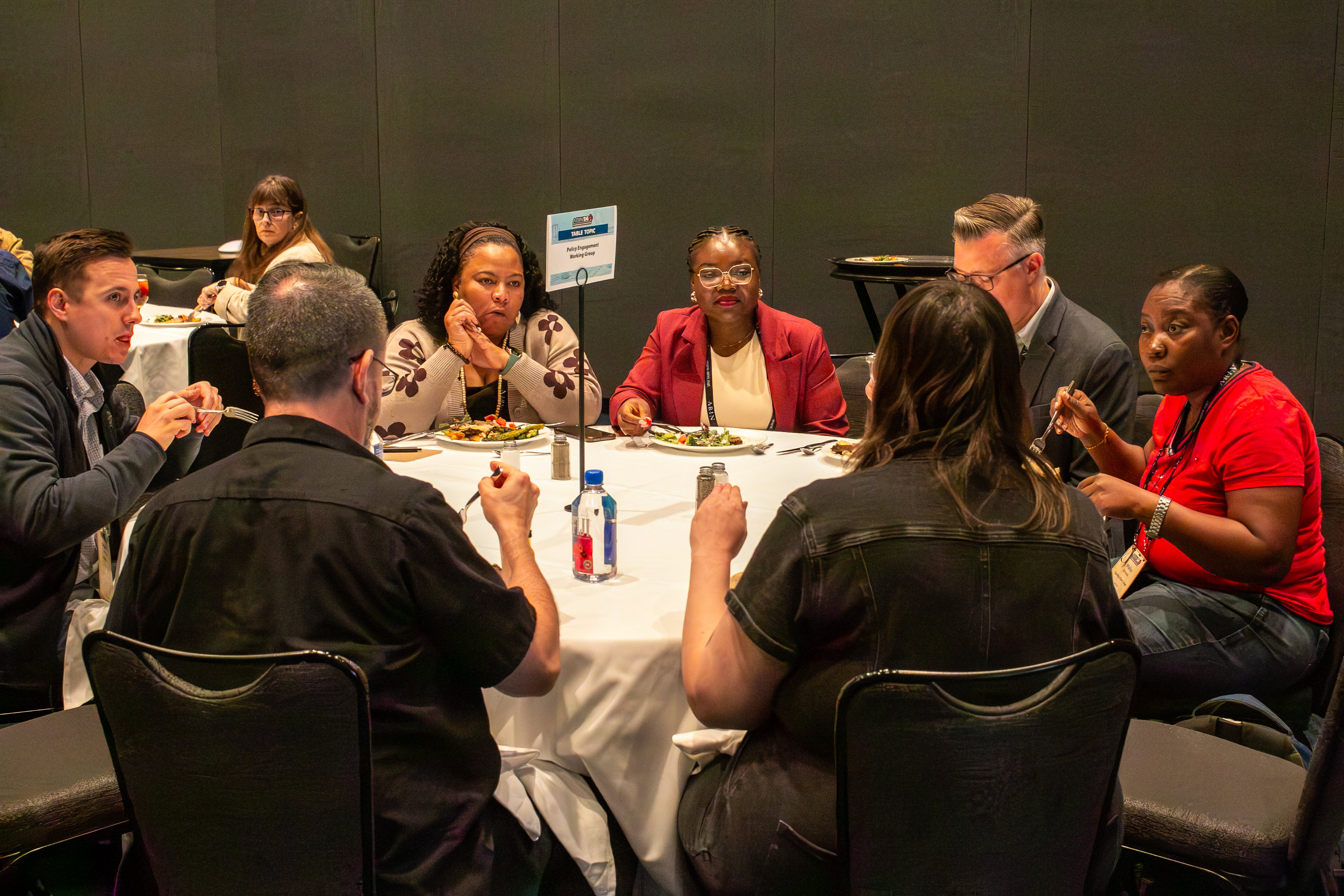Attendees discuss a table topic at lunch